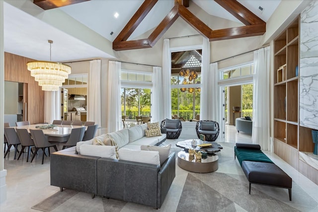 living room with high vaulted ceiling, a chandelier, and beamed ceiling