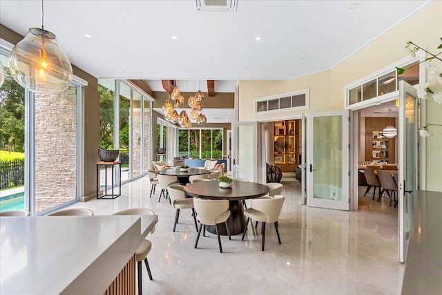 dining room with a chandelier and french doors