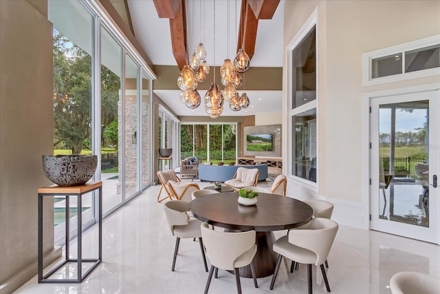 sunroom with an inviting chandelier