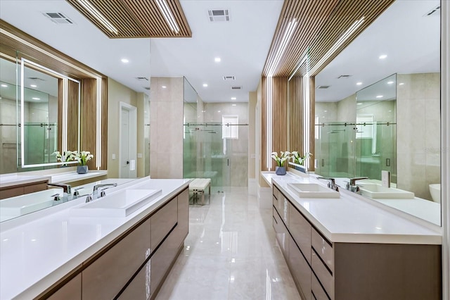 bathroom featuring a shower with shower door, toilet, and vanity