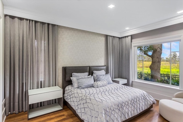 bedroom with hardwood / wood-style flooring