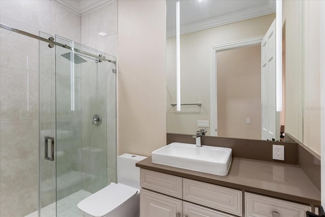 bathroom featuring ornamental molding, vanity, toilet, and a shower with shower door