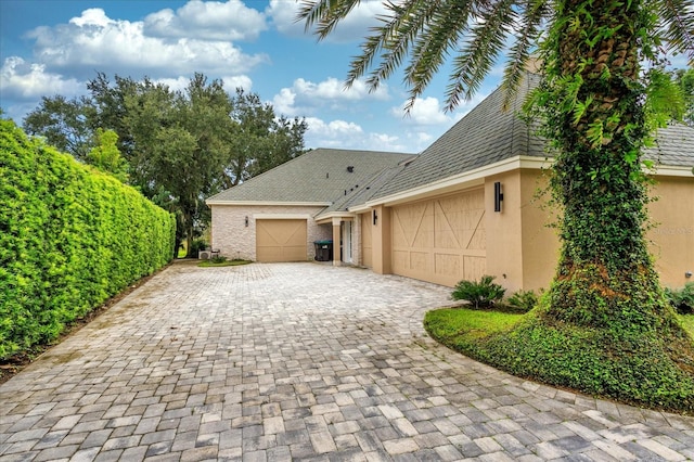 view of side of property with a garage