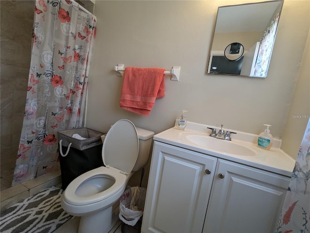 bathroom featuring a shower with curtain, toilet, and vanity