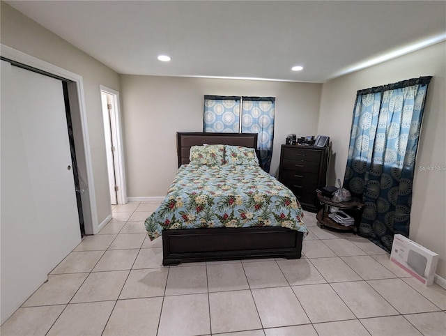 bedroom featuring a closet and light tile patterned flooring