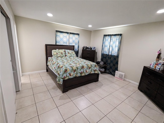 bedroom featuring light tile patterned flooring