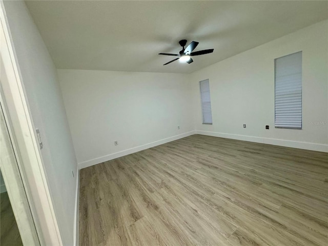 unfurnished room featuring ceiling fan and light wood-type flooring