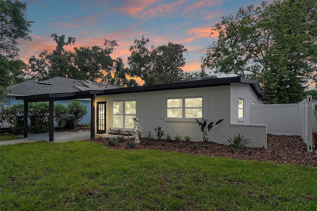 view of front of property featuring a patio area and a yard