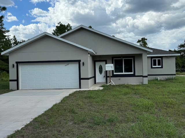 ranch-style house with a garage and a front lawn