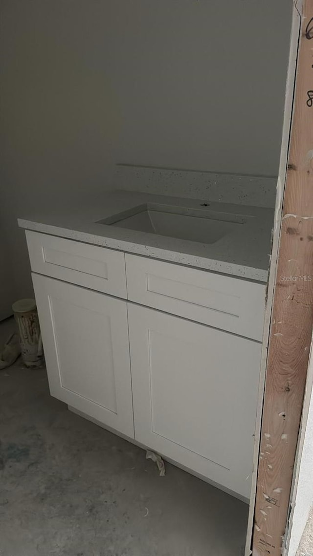 bathroom featuring concrete floors