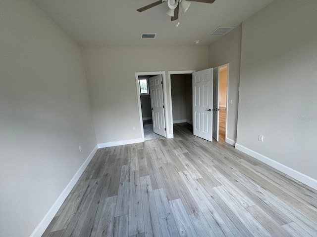 unfurnished bedroom with ceiling fan and light hardwood / wood-style floors