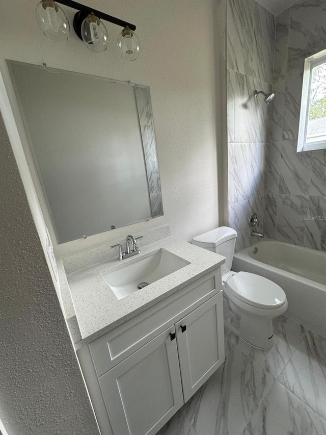 full bathroom featuring vanity, toilet, and tiled shower / bath combo