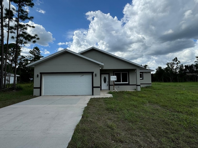 view of front of property featuring a garage and a front yard