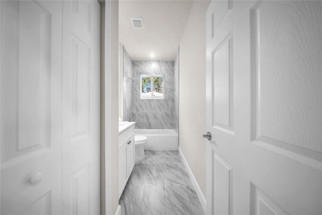 bathroom featuring marble finish floor, bathing tub / shower combination, visible vents, vanity, and baseboards