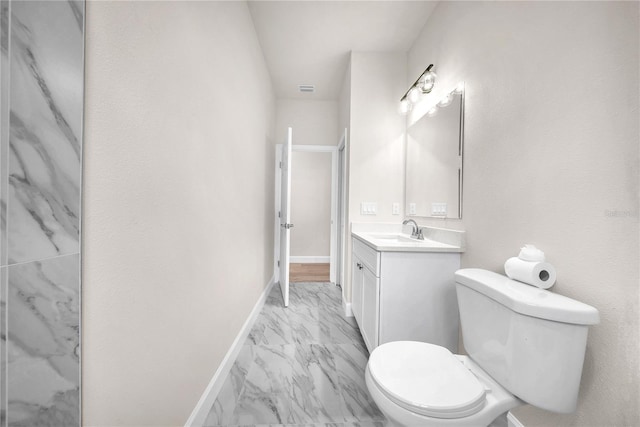 bathroom featuring marble finish floor, visible vents, toilet, vanity, and baseboards