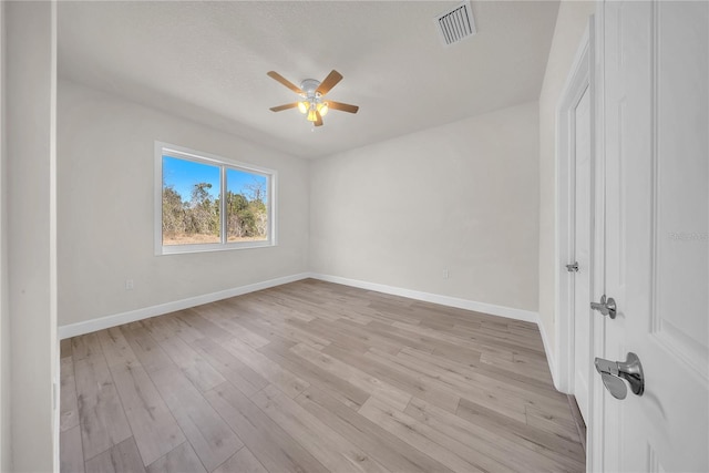 unfurnished bedroom featuring light wood-style flooring, visible vents, and baseboards