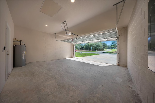 garage with a garage door opener and water heater