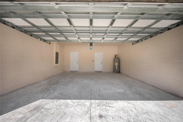 garage featuring a garage door opener, electric water heater, and electric panel