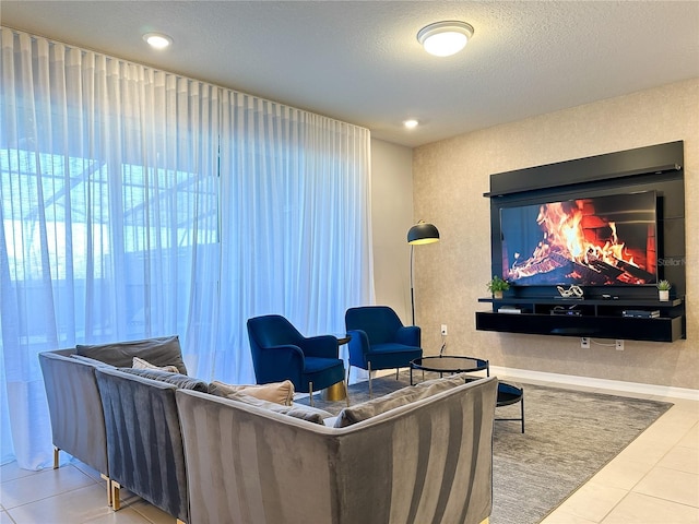 tiled living room featuring recessed lighting, baseboards, and a textured ceiling