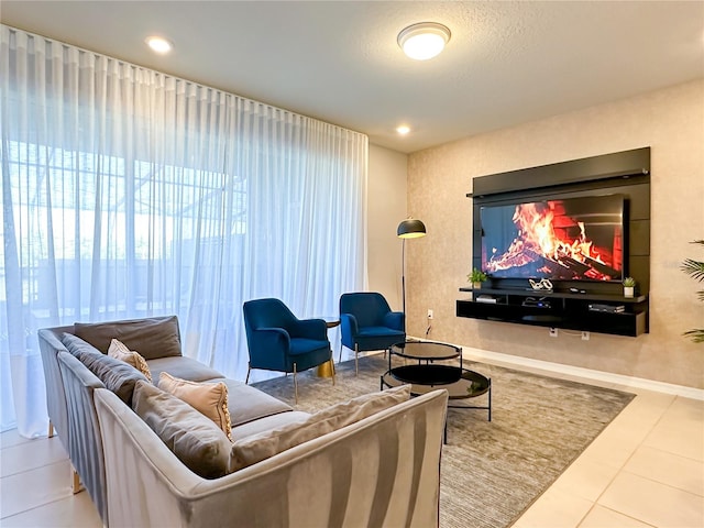 living room with a textured ceiling and tile patterned floors