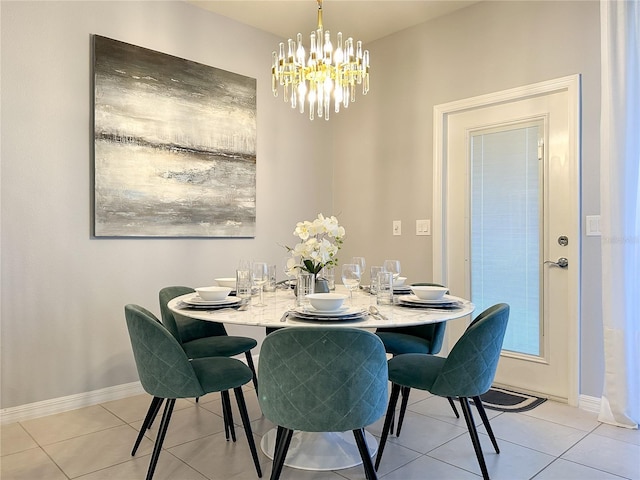 dining space featuring light tile patterned floors, an inviting chandelier, and baseboards