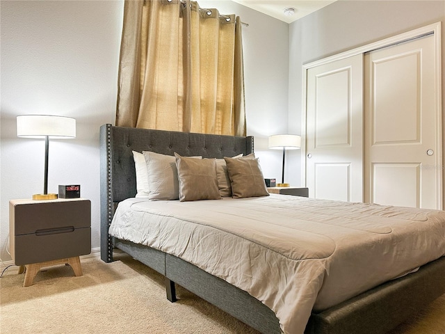 carpeted bedroom with a closet