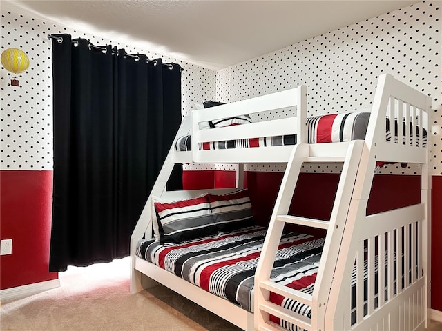 carpeted bedroom featuring wallpapered walls