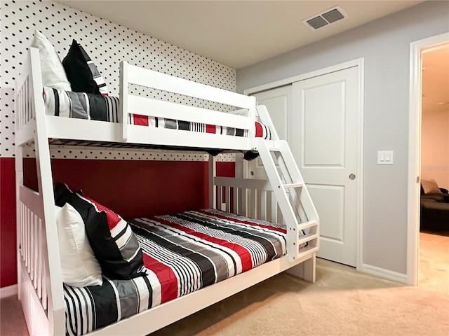 bedroom with carpet flooring, baseboards, and visible vents