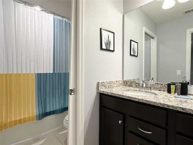 bathroom featuring walk in shower, toilet, and vanity