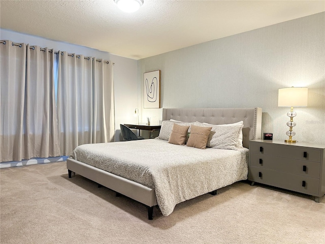 carpeted bedroom featuring a textured ceiling