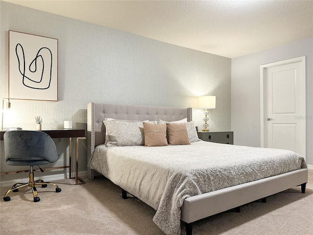 carpeted bedroom featuring baseboards