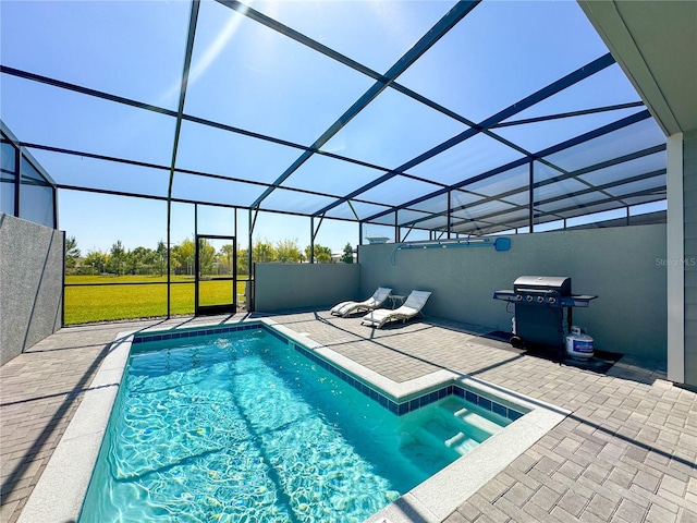 view of pool with area for grilling, a lanai, and a patio area