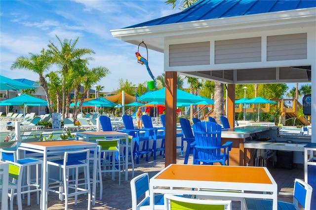 view of jungle gym featuring exterior bar