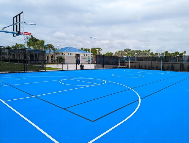 view of basketball court featuring community basketball court and fence