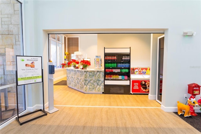 recreation room with wood finished floors and baseboards