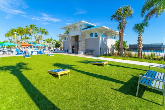 exterior space featuring a yard and fence