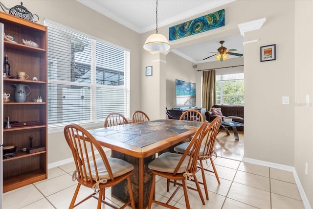 dining room featuring light tile patterned floors, ceiling fan, and ornamental molding