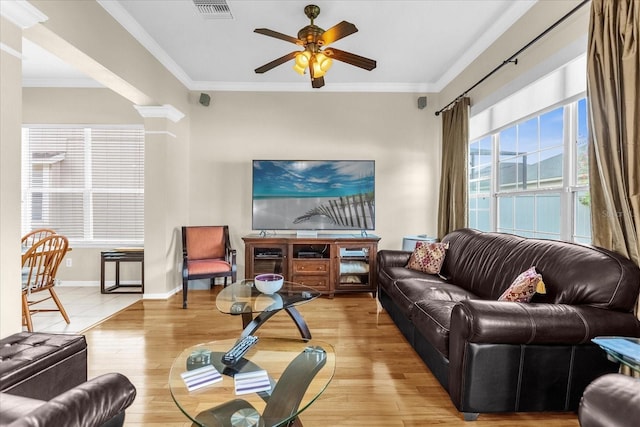 living room featuring crown molding, ceiling fan, and light hardwood / wood-style floors