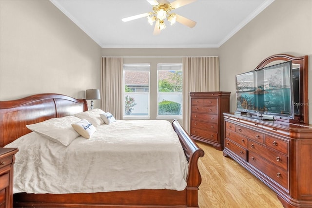 bedroom featuring ceiling fan, light hardwood / wood-style flooring, and crown molding