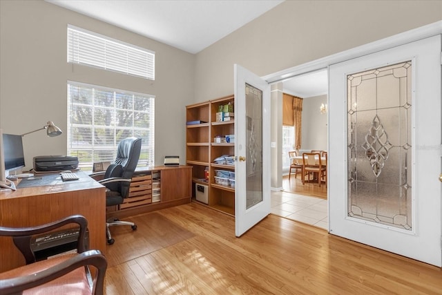 office space featuring light wood-type flooring and french doors