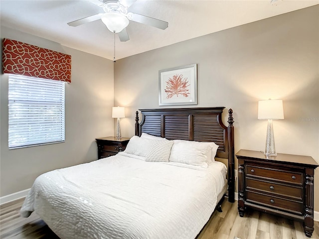 bedroom featuring light hardwood / wood-style flooring and ceiling fan