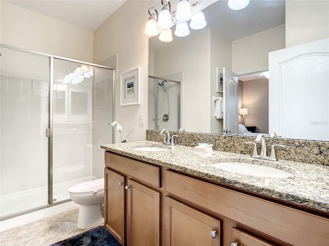 bathroom with tile patterned flooring, walk in shower, toilet, a chandelier, and vanity