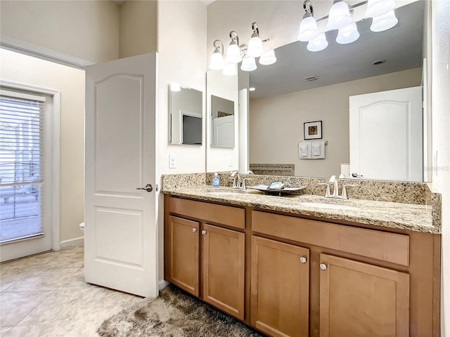 bathroom with tile patterned flooring, toilet, and vanity