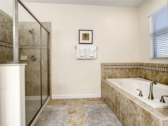 bathroom with tile patterned floors and plus walk in shower