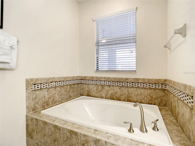 bathroom with tiled tub