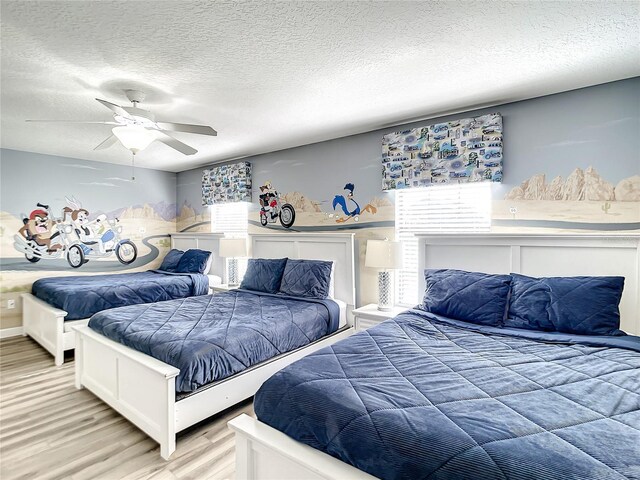 1410 Wexford Way, Davenport, FL 33896 - bedroom with light wood-type flooring, a textured ceiling, and ceiling fan