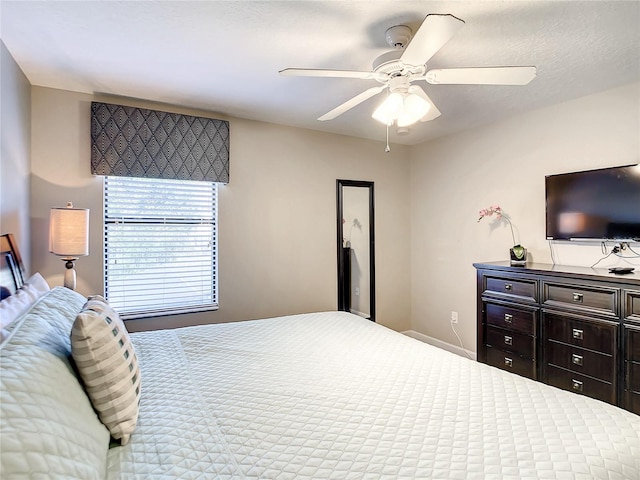 bedroom featuring ceiling fan