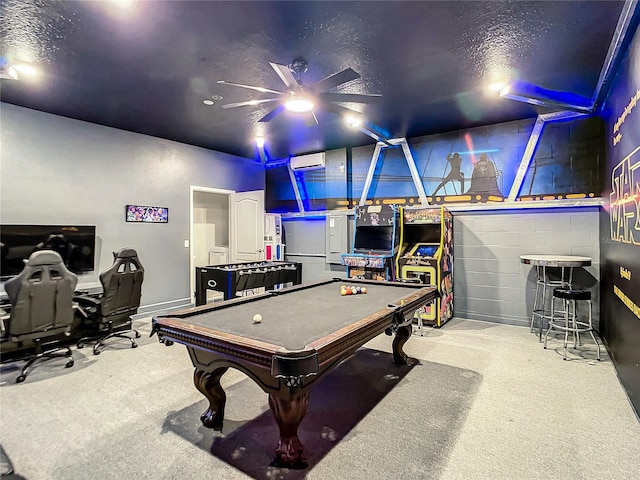 rec room with light carpet, a wall mounted air conditioner, a textured ceiling, pool table, and ceiling fan