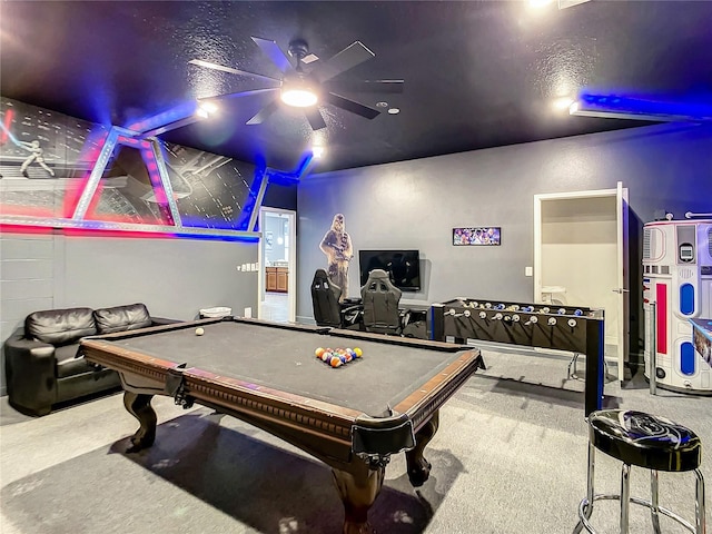 recreation room with billiards, ceiling fan, carpet floors, and a textured ceiling