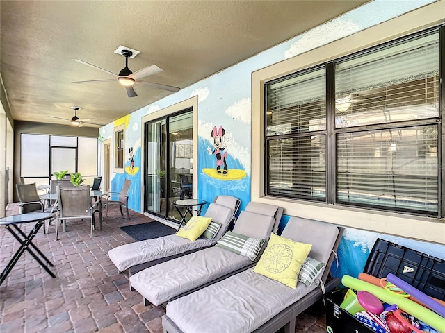 view of patio / terrace featuring ceiling fan